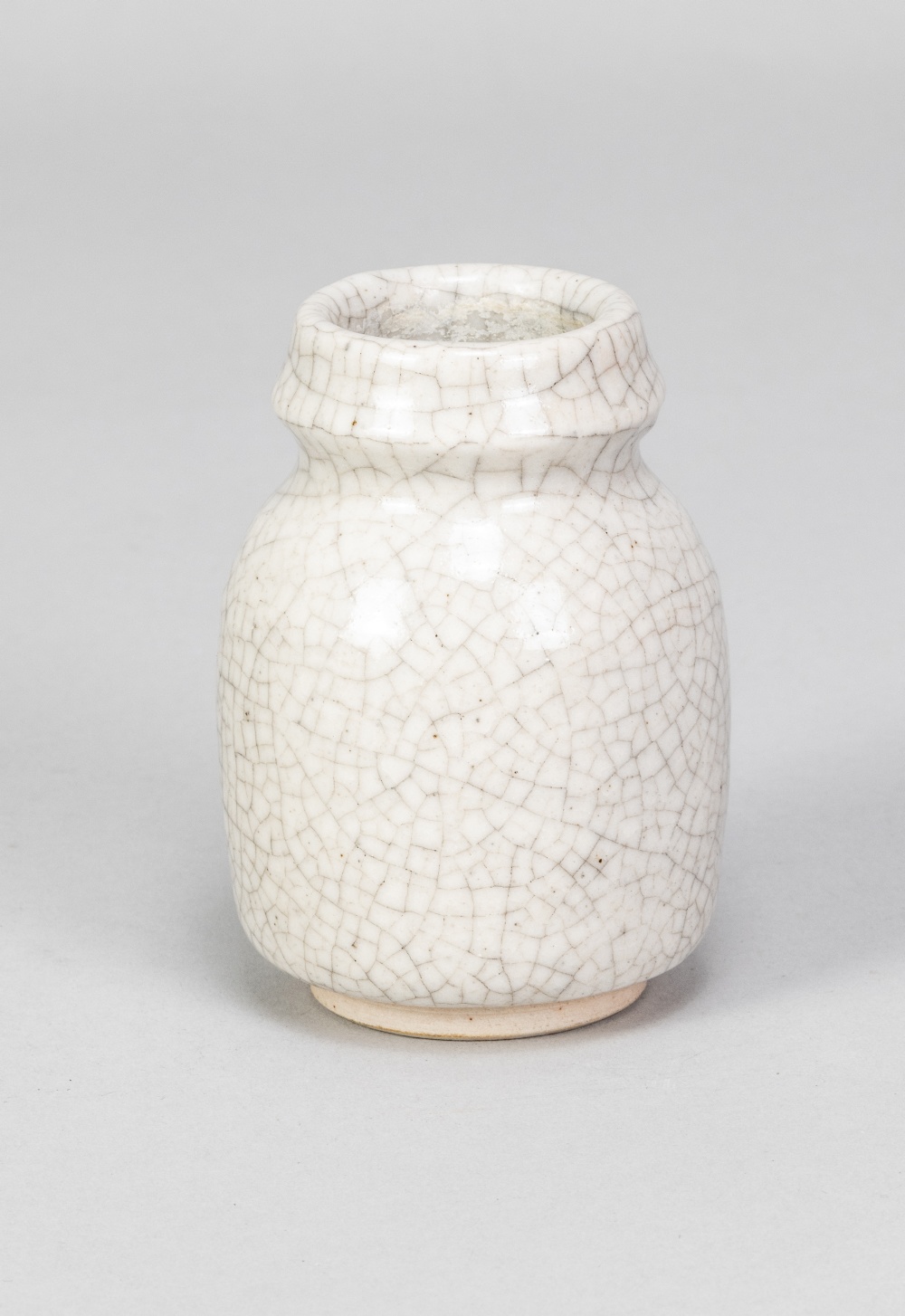 CONSTANCE DUNN; a small stoneware vase covered in white crackle glaze, impressed W mark, made - Image 2 of 5