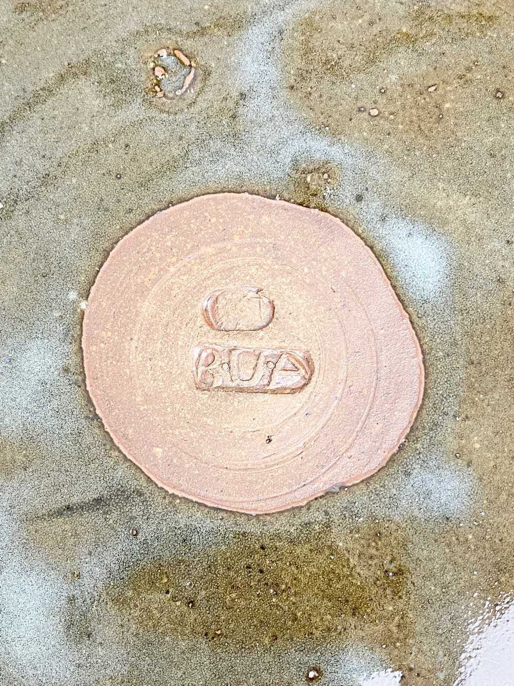 BAWA USHAFA for Abuja Pottery; a large stoneware platter with wax resist decoration on tenmoku - Image 4 of 4