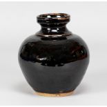 URSULA MOMMENS (1908-2010); a stoneware bottle covered in tenmoku breaking to kaki glaze,