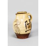 SAM HAILE (1909-1948); a slipware jug partially covered in yellow glaze with incised and painted