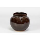 URSULA MOMMENS (1908-2010); a stoneware vase covered in tenmoku breaking to kaki glaze, impressed UD