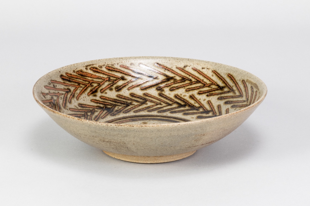 HELEN PINCOMBE (1908-2004); a shallow stoneware footed bowl with tenmoku breaking to kaki decoration - Image 2 of 4