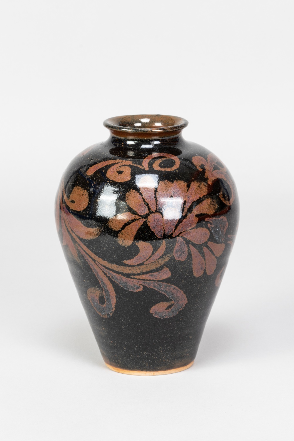 CHARLES VYSE (1882-1971); a stoneware vase with floral decoration on tenmoku ground, incised CV mark