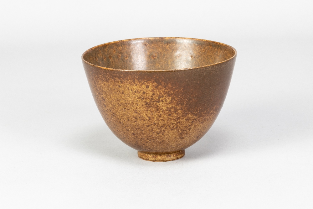 WAISTEL COOPER (1921-2003); an early stoneware footed bowl covered in mottled iron glaze, incised