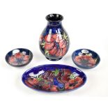 MOORCROFT; four pieces decorated in the 'Anemone' pattern, comprising a baluster form vase, height