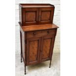 An early to mid-19th century mahogany side cabinet of small proportions, with two panelled doors