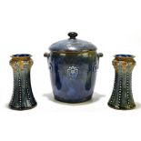 ROYAL DOULTON; a stoneware twin handled lidded biscuit twin barrel with floral devices in relief,