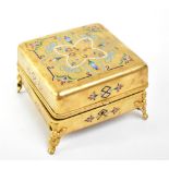 A 19th century French Palais Royale gilt metal and enamel jewellery casket, of square form, the