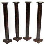 Four painted wooden columns with carved square terminals, height 134cm (4).Additional