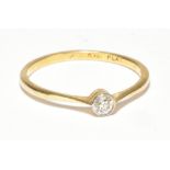 An 18ct yellow gold and diamond solitaire ring, the collet set stone weighing 0.07ct, ring size U,