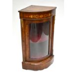 A 19th century walnut and inlaid glazed bow front corner cupboard with applied gilt metal detail,