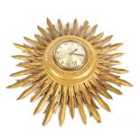 SMITHS ELECTRIC; a 1950s gilt wood sunburst wall clock, the silvered dial with Arabic numerals and