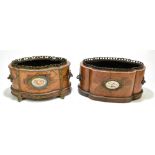 A pair of French 20th century kingwood and rosewood veneered cachepots of shaped oval form, the