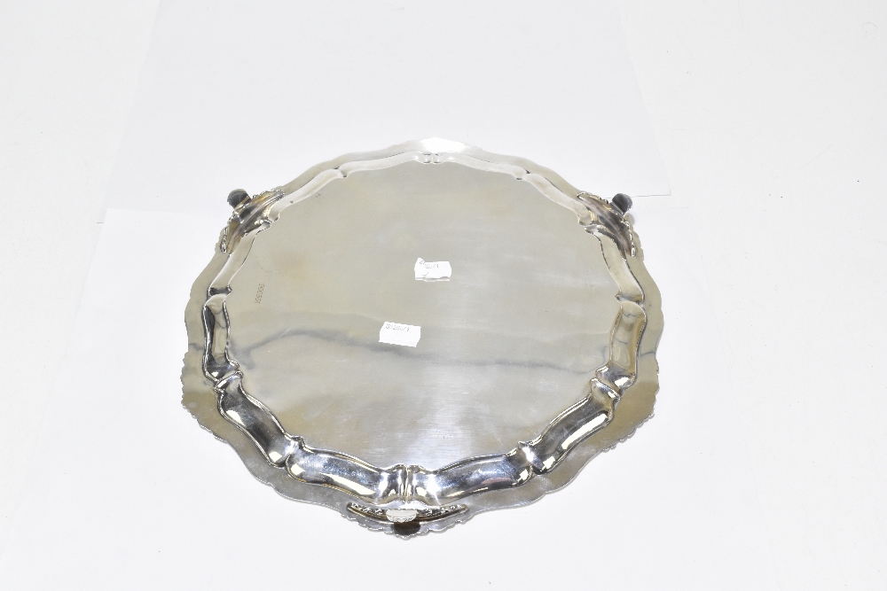 ATKIN BROS; a George V hallmarked silver salver raised on three scrolling supports, Sheffield - Image 3 of 5