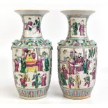 A pair of late 19th/early 20th century Chinese porcelain Famille Rose vases with twin shi-shi dog