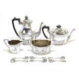 WALKER & HALL; a Victorian and Edward VII hallmarked silver four piece tea set, comprising teapot