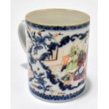 An 18th century Chinese Famille Rose mug decorated with stylised figures inside panels of floral