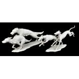KAISER; two bisque porcelain figures representing sprinting dogs, each with impressed indistinct