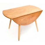 ERCOL; a contemporary light elm drop leaf dining table raised on tapering block supports, length