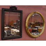 A gilt wood and gesso circular wall mirror, diameter 60cm approx, with a rectangular wall mirror,