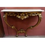 An early-mid 20th century French Louis XVI-style marble topped gilt console table of serpentine