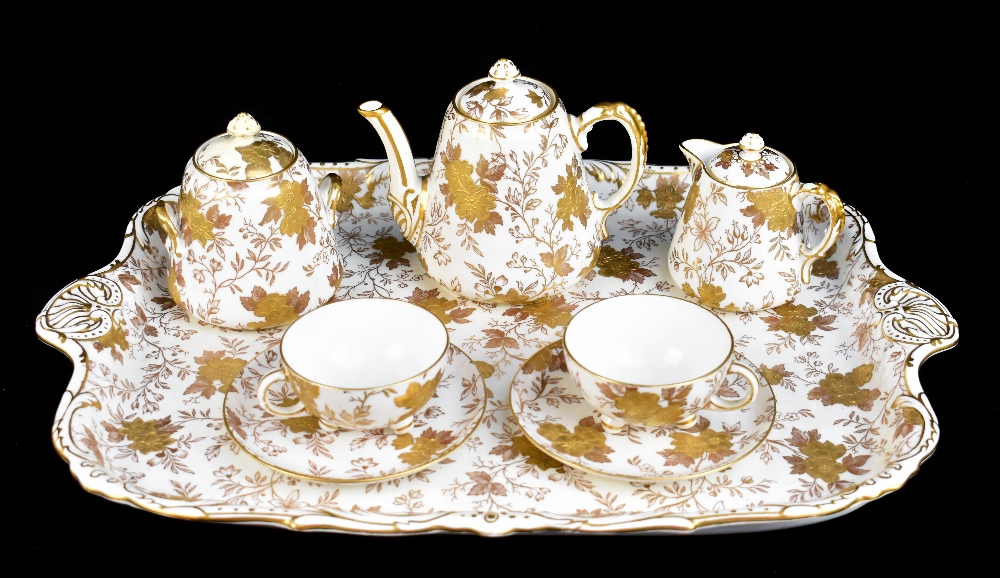 DAVENPORT; an eight piece bachelor service, transfer printed with floral sparys and gilt highlights,