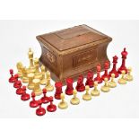 IN THE MANNER OF STAUNTON; a late 19th century natural and stained ivory chess set, pieces unmarked,