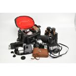 A pair of Sotem 7x50 binoculars, a Yashica TL-Electro camera and various other cameras.