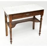 An Edwardian stained pine marble top wash stand, with frieze drawer and undertier on turned and