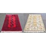 An Afghan Bokhara red ground rug, 180 x 114cm, and a beige Caucasian example, 186 x 121cm (2).