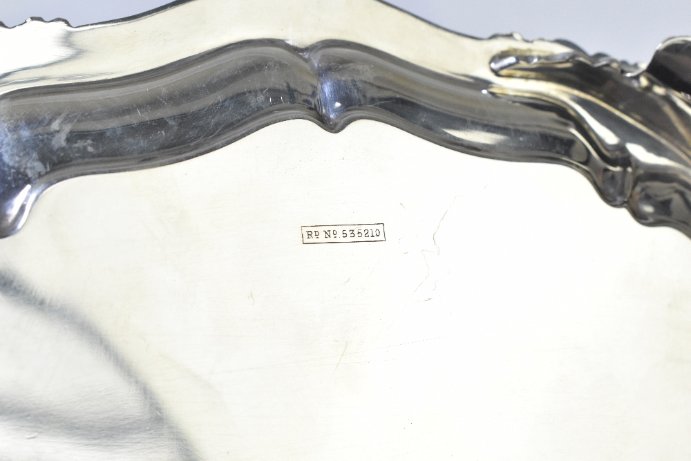 ATKIN BROS; a George V hallmarked silver salver raised on three scrolling supports, Sheffield - Image 4 of 5