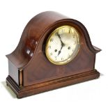 An Edwardian mahogany cased dome topped eight day mantel clock with inlaid decoration, the