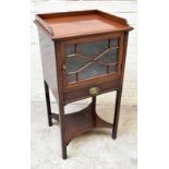 An Edwardian mahogany cabinet, with three quarter gallery above an astraglazed door and drawer,