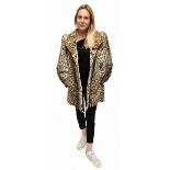 A vintage 1960s ocelot fur jacket with long sleeves, fully lined, size Medium.Additional