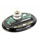 A Victorian Ashford marble inlaid slate oval inkstand, inlaid with malachite and other stones with