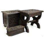 A late 19th century carved oak stool, the top decorated with a dragon, height 35cm, and a similar