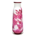 AFTER EMILE GALLE; a moulded glass vase decorated with flowers and leaves in shades of pink