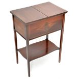 An Edwardian mahogany and line inlaid sewing table with sliding rectangular top enclosing a