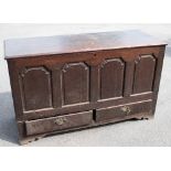 An 18th century oak mule chest with panelled front above two drawers on stile legs, height 84cm,