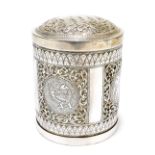 An Eastern white metal cylindrical tea canister and cover, the lift-off lid decorated with an