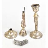 A T CANNON LTD; a pair of Elizabeth II hallmarked silver candlesticks, with cast beaded foot rims,