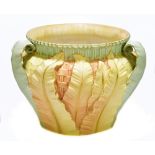 ROYAL WORCESTER; a large blush ivory jardinière decorated in relief with leaves, height 17cm tall.