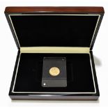 A Victorian shield back half sovereign, 1884, slabbed and in presentation box.Additional