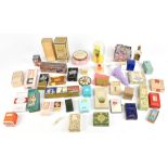 A collection of forty vintage perfumes, mostly boxed, used and unused, including Hermes Caleche,