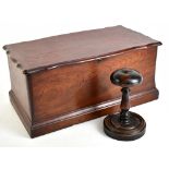 A large mahogany box of shaped outline, 22.5 x 49 x 27cm, and a stained mahogany wig stand, height