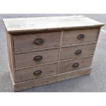 An old pine chest of six drawers, raised on plinth base, width 116cm, depth 46cm, height 77cm (af).