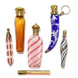 A collection of six Victorian and Edwardian coloured glass scent bottles, to include a ruby and