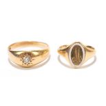 An 18ct yellow gold and white enamelled small signet ring engraved with the letter 'M' within a