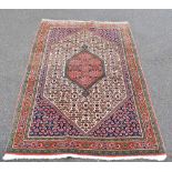 A Kayam wool rug, worked with a central red hound medallion and overall geometric foliage motifs,
