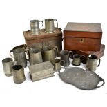 A collection of 19th century and later pewter mugs and tankards, with an Art Nouveau pewter twin